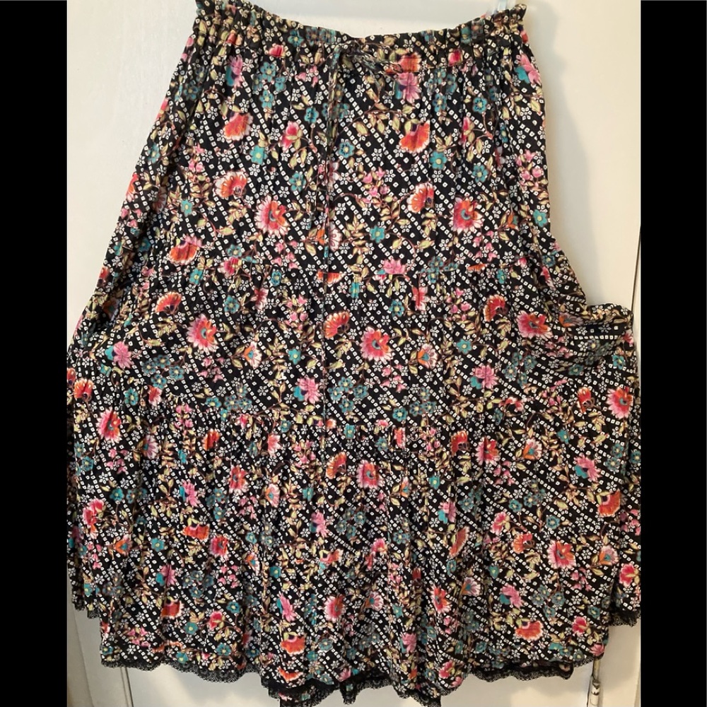 Great "dancing skirt," pink, green, white flowers on black, hint of bottom lace.